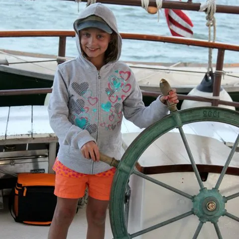 Sofia Rosinsky standing in front of a plane