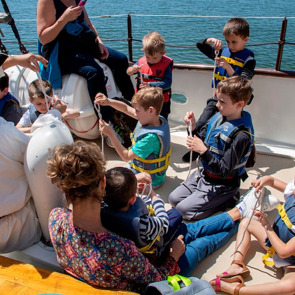 a group of people sitting on a boat
