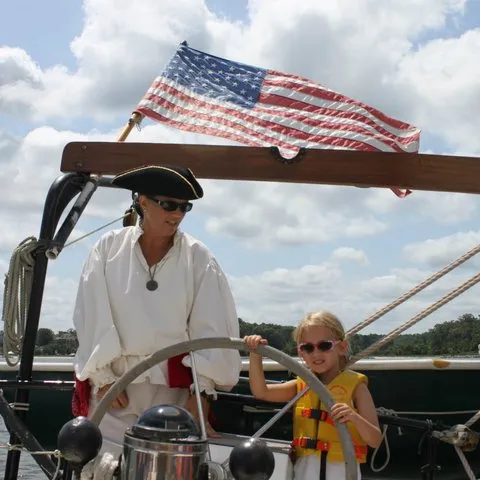 a man riding on the back of a boat