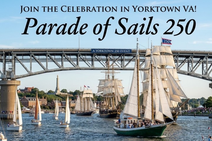 Tall ships sail under bridge at Parade of Sails event in Yorktown.